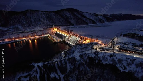 Hydroelectric dam on the river, filming at night with illumination