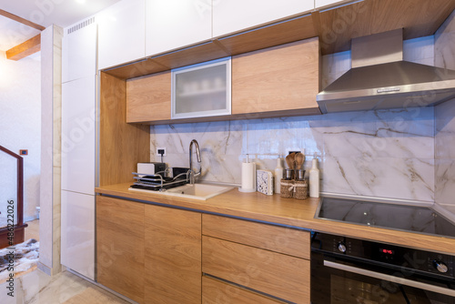 Kitchen interior in modern new mountain apartment