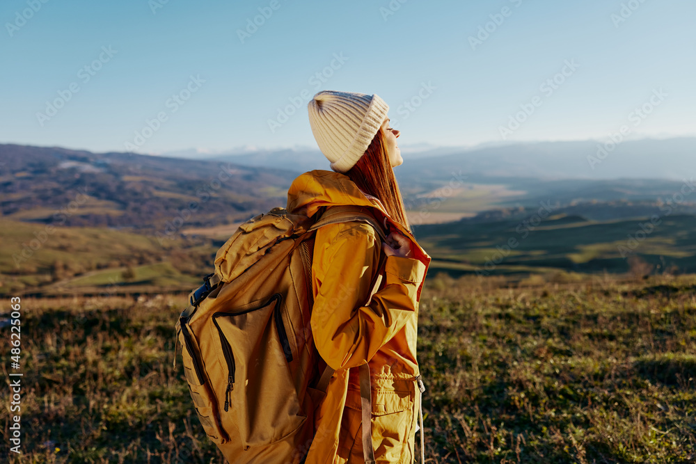Fototapeta premium woman tourist backpacking trip to mountains landscape relaxation