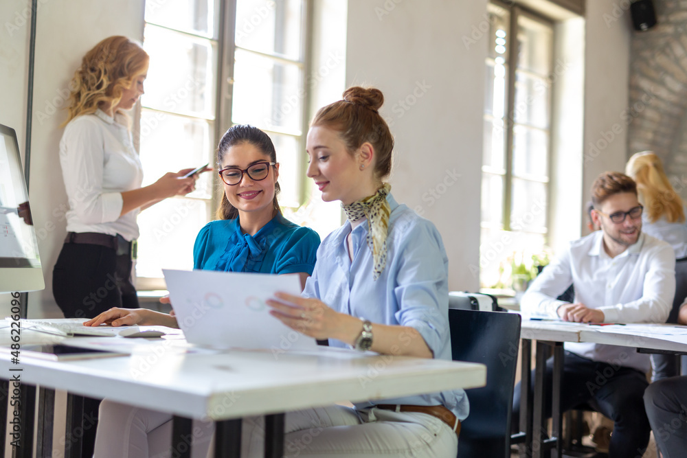 Group of multiethnic business people working at the office. Startup finance teamwork concept Group of multiethnic business people working at the office. Startup finance teamwork concept