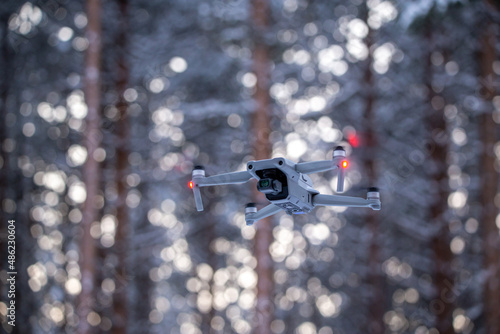 Drone flying snowy tree background