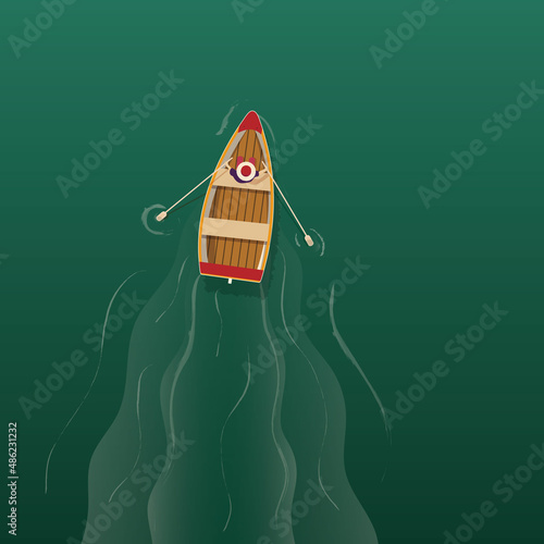 A man rows with oars while sitting in a boat. View from above. A wooden boat cuts through the water.