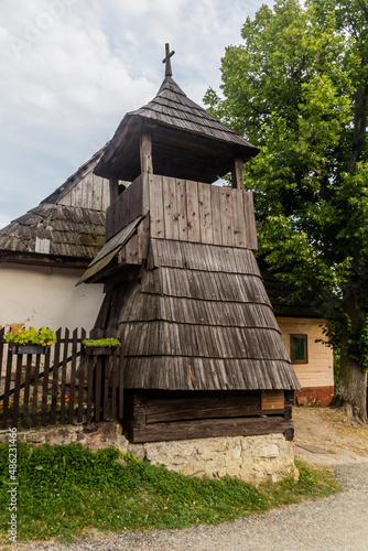 Wooden bell tower in Vlkolinec village in Nizke Tatry mountains, Slovakia photo
