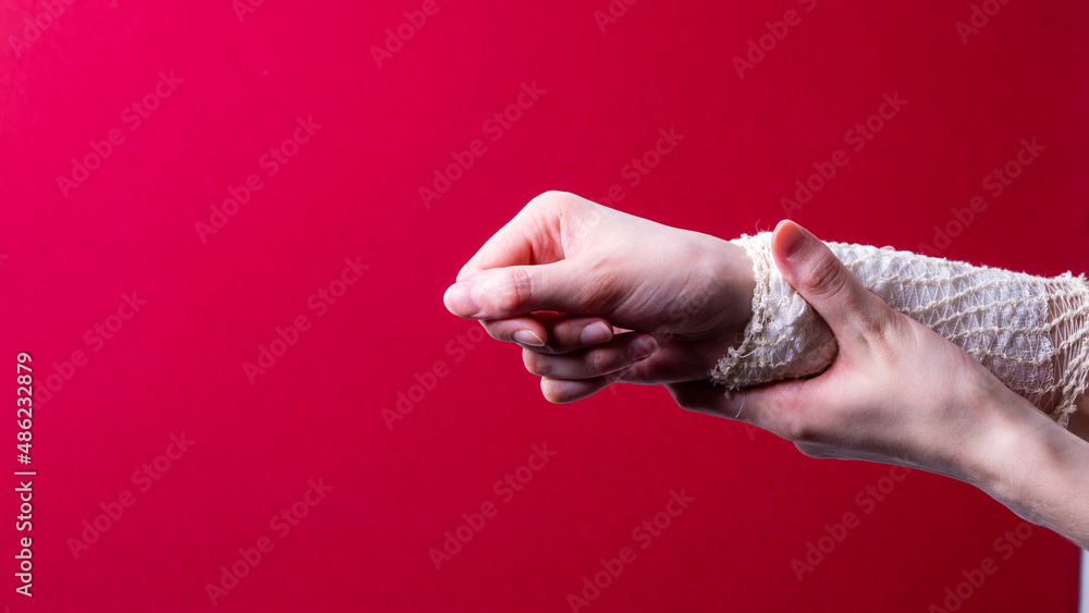 Fototapeta premium woman's hand bandaged with a medical bandage