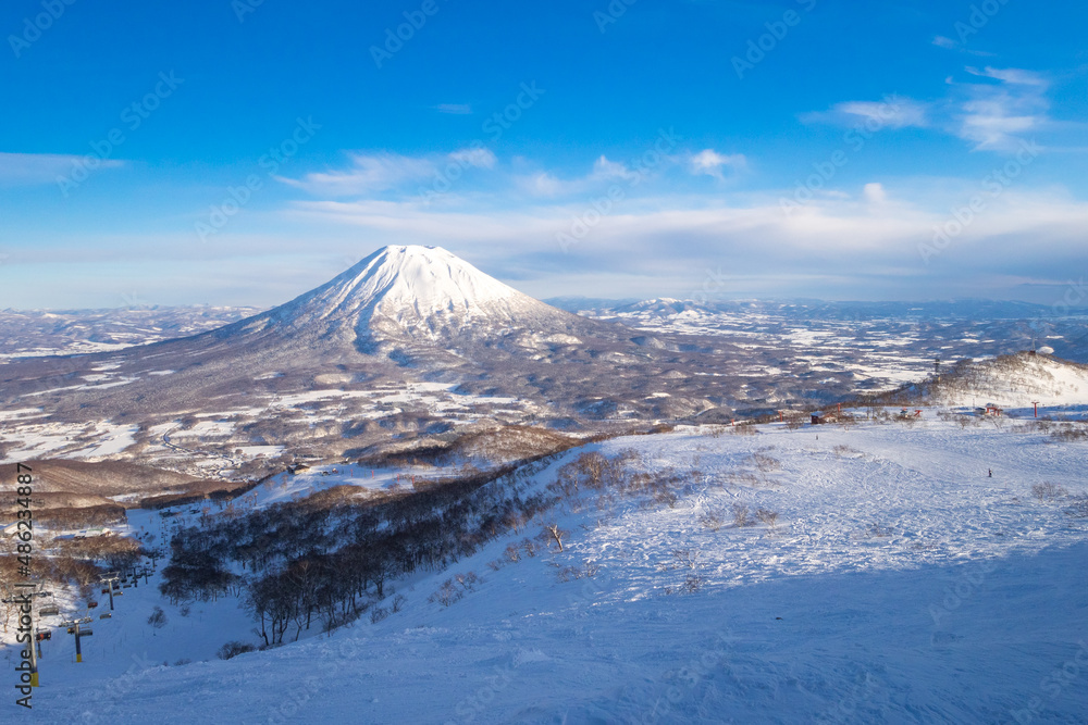 Snowy volcano viewed from a ski resort in late afternoon (Niseko, Hokkaido, Japan) Snowy volcano viewed from a ski resort in late afternoon (Niseko, Hokkaido, Japan)