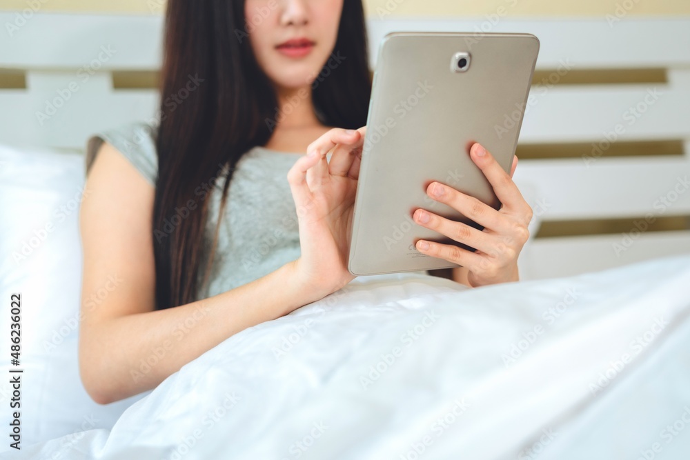 Portrait asian woman using computer laptop in bedroom work from home, Technology communication lifestyles concept. Portrait asian woman using computer laptop in bedroom work from home, Technology communication lifestyles concept.