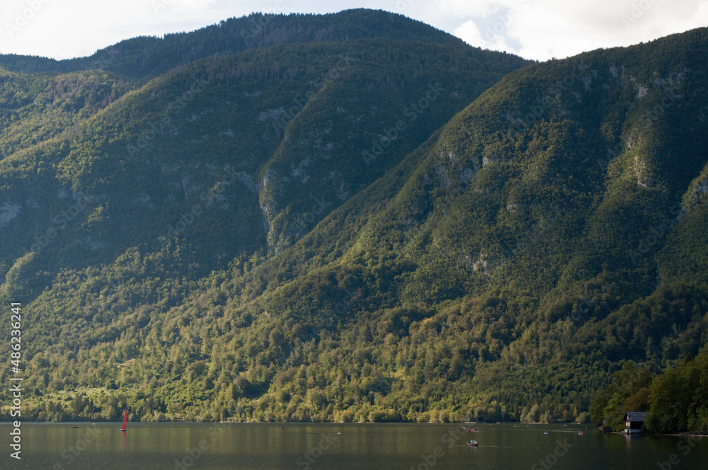 Fototapeta premium Sunlight on Bohinjsko Jezero Mountains