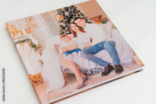 cover of Photobook with photos of family photo shoot. photo
