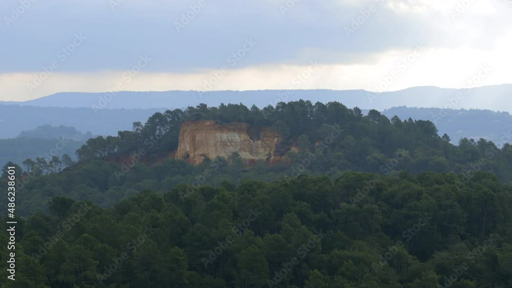 Ocher cliffs surrounding the village of Roussillon in the Luberon valley in Provence, France Ocher cliffs surrounding the village of Roussillon in the Luberon valley in Provence, France