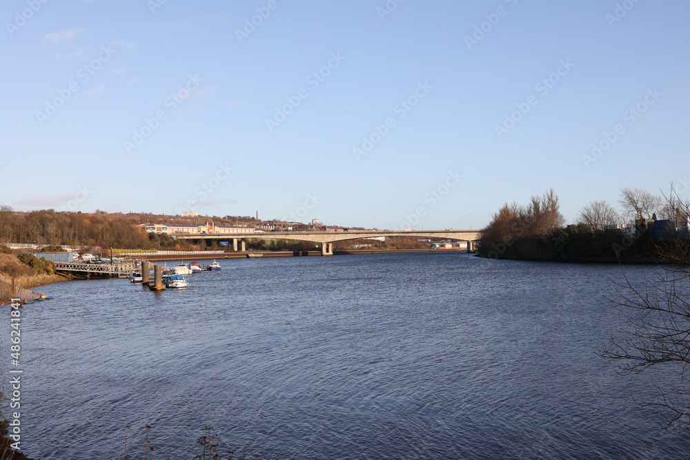 Newcastle UK: 31st Jan 2022: Newburn Riverside at the River Tyne,  waves on a windy day with the A1 motorway bridge and BandQ in the background