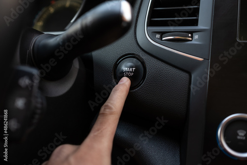 Finger press start stop button. Keyless system. Black plastic interior with chrome interior © Stanislav