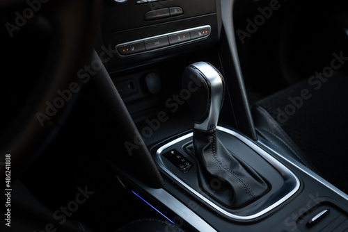 Automatic transmission gear with leather of luxury car. Black interior with chrome details © Stanislav