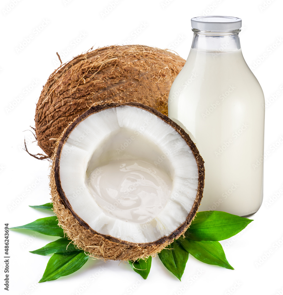 Bottle of coconut milk and coconut fruit isolated on white background. Bottle of coconut milk and coconut fruit isolated on white background.