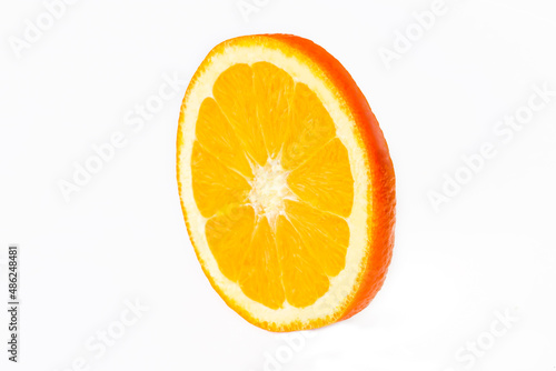 Orange fruit slice isolated on white background closeup. Food background. Flat lay  top view.