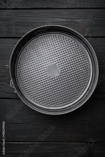 Metal empty Baking tray, with copy space for text or food, with copy space for text or food, top view flat lay , on black wooden table background