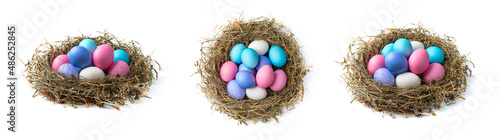 A set of three nests with Easter eggs in different angles isolated on a white background. photo