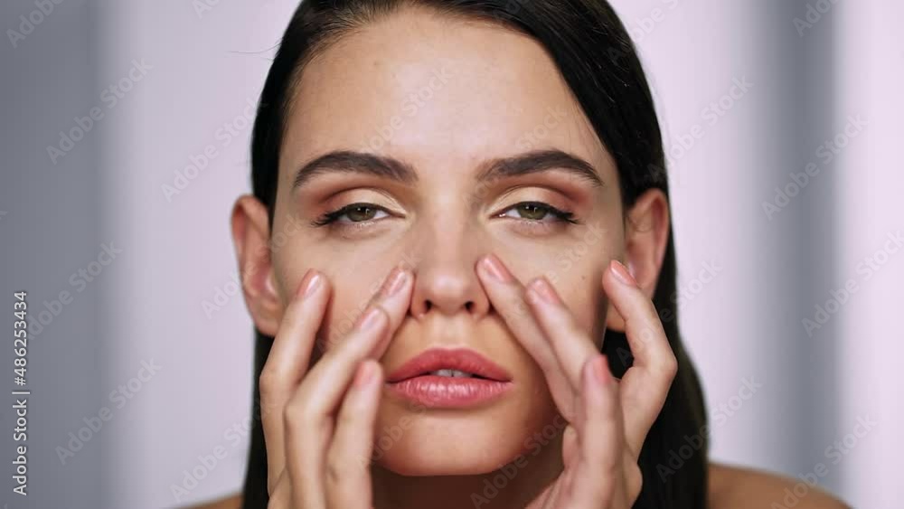 Beautiful girl touches her nose and thinks about rhinoplasty. Dream of plastic surgery Beautiful girl touches her nose and thinks about rhinoplasty. Dream of plastic surgery