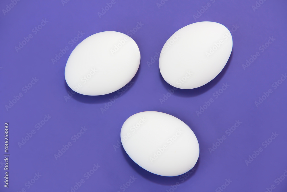 white easter eggs on purple background very peri white easter eggs on purple background very peri