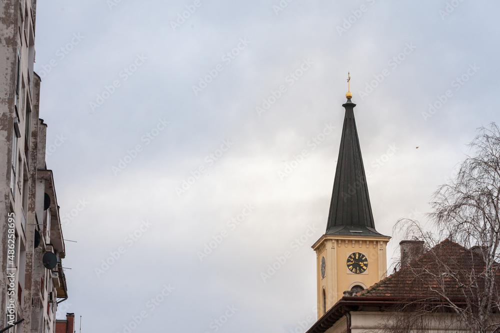 Church clocktower steeple of the serbian roman catholic church of crkva svetog karla boromejskog, also called church of saint carlo borromeo in Pancevo Voivodina, Serbia with its iconic clock...