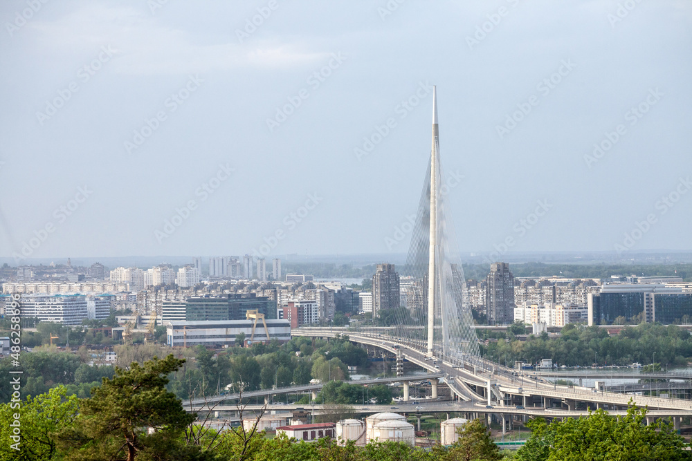 Panorama and skyline of the high rises of Novi Beograd District with the Ada Most bridge with highway streets in front. New Belgrade is the business district of the city...