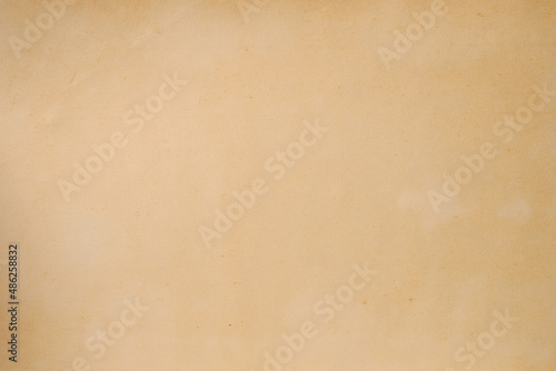 The texture of an old yellowed paper. Background.