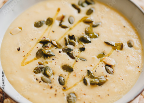 Close-up of celeriac cream soup with pumpkin seeds