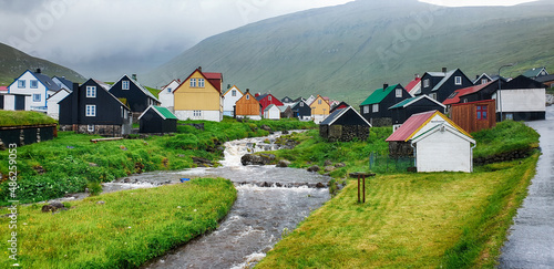 Vászonkép Picturesque view on village of Gjogv with typically colourful houses on the Eyst