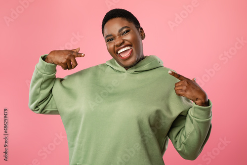 Joyful African American Lady Pointing Fingers At Herself, Pink Background