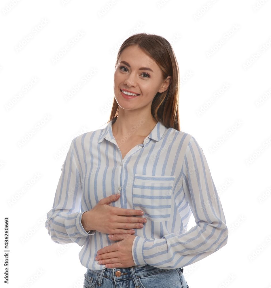 Healthy woman holding hands on belly against white background Healthy woman holding hands on belly against white background