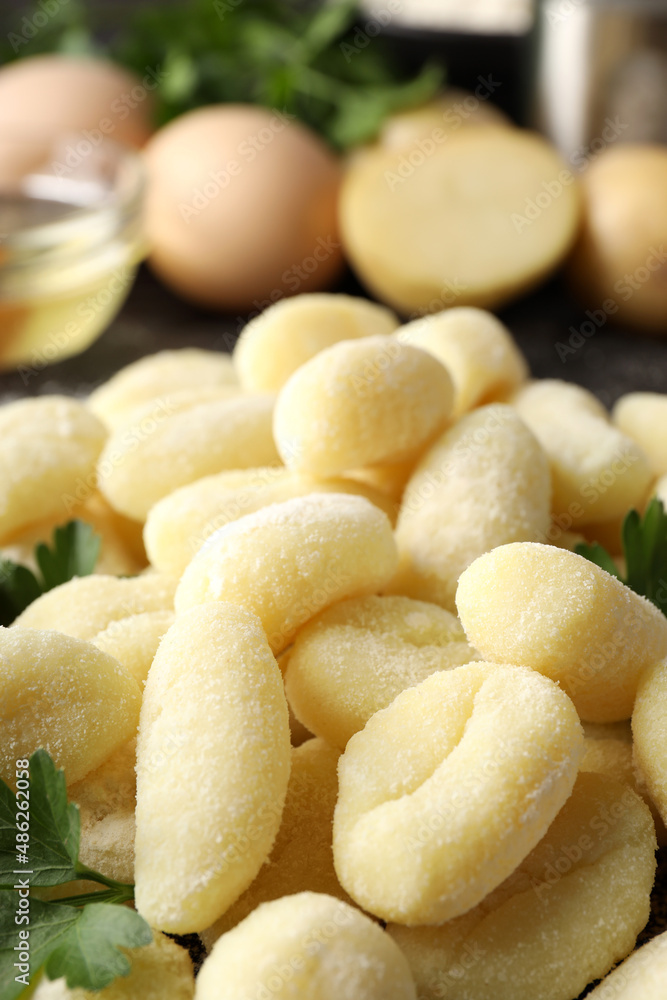 Concept of cooking with raw potato gnocchi, close up Concept of cooking with raw potato gnocchi, close up