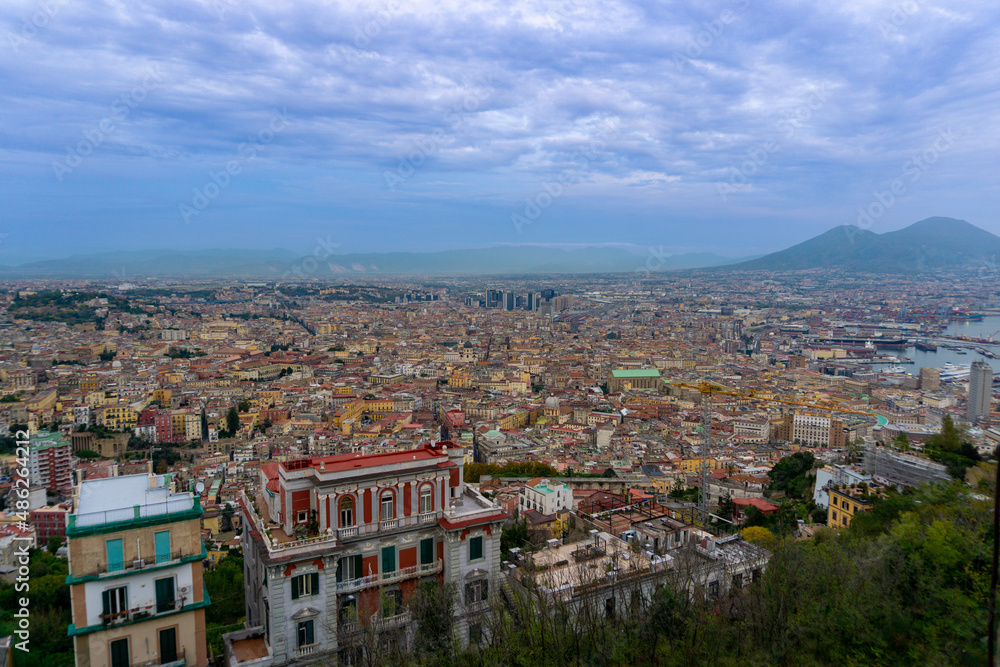 Panoramic view of Naples with Vesuvius in the background, the sky with clouds.