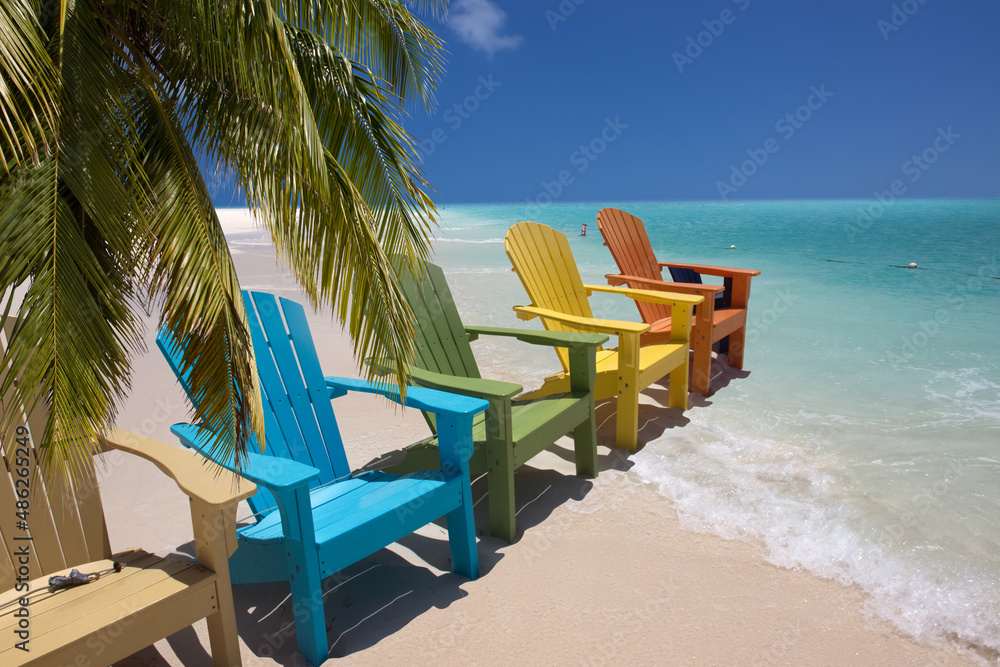 Colorful beach chairs on caribbean coast