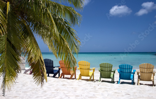 Fototapeta Naklejka Na Ścianę i Meble -  Colorful beach chairs on caribbean coast