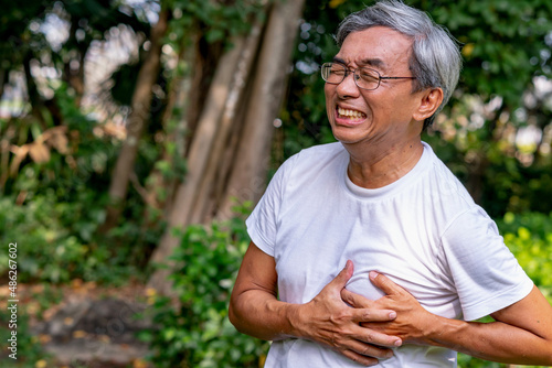 asian older man chest pain.life insurance , retirement.