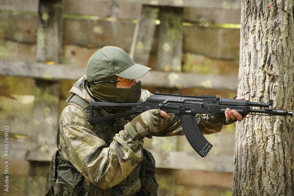 Fototapeta premium soldier with guns, airsoft russia, russian soldier in the woods with guns