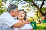 Happy asian elderly couple relax in park,  relationship retirement, People lifestyle concept.