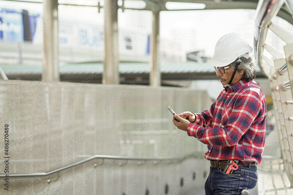 Engineer with tool equipment service and construction and protective white helmet. Engineer with tool equipment service and construction and protective white helmet.