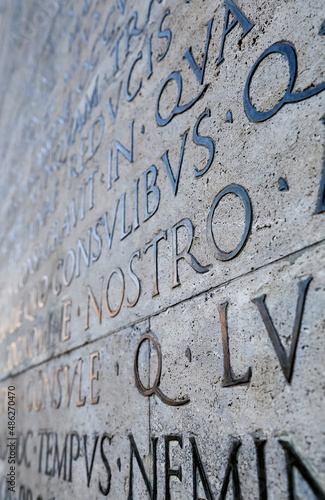 Latin inscription on the outside wall of the peace altar in Rome. Ara Pacis wall in Rome, Italy. photo