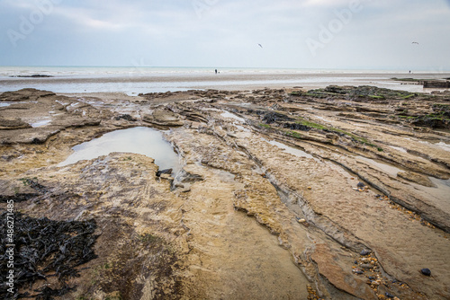 Rocky beach at Cooden Beach, East Sussex, England photo