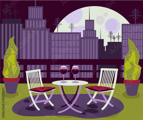 Cozy restaurant on rooftop with table and two chair in the big city with the cityscape evening or night