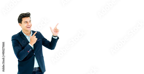 Portrait young handsome man in suit point to copy space on white background for your promotional or text isolated on white background.