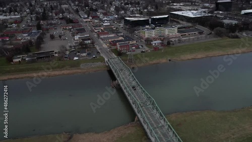 Corning NY USA, Drone Aerial View of Bridge Above Chemung River and Town on Riverbanks photo