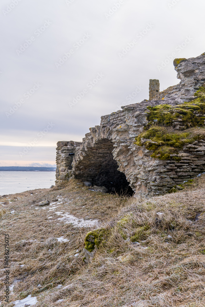 Vertical view of Toolse Fortress on the Baltic Sea in Northern Estonia on a moody day at sunrise