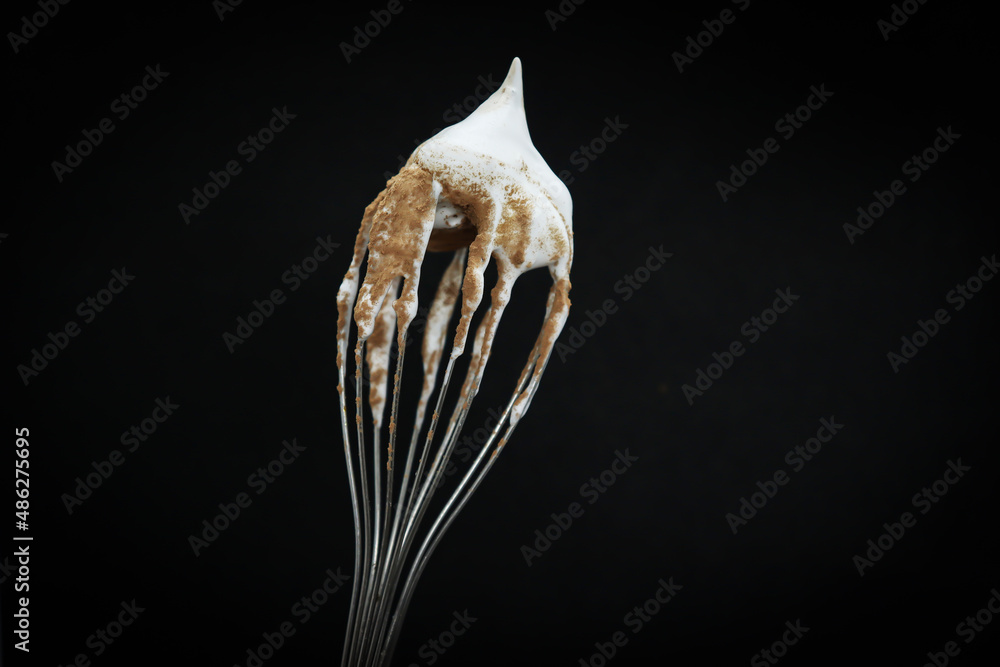 Naklejka premium Sweet whipped cream sprinkled with cocoa