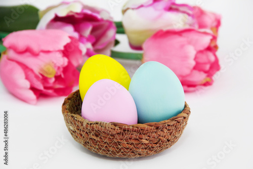 colorful easter eggs and flowers pink tulips