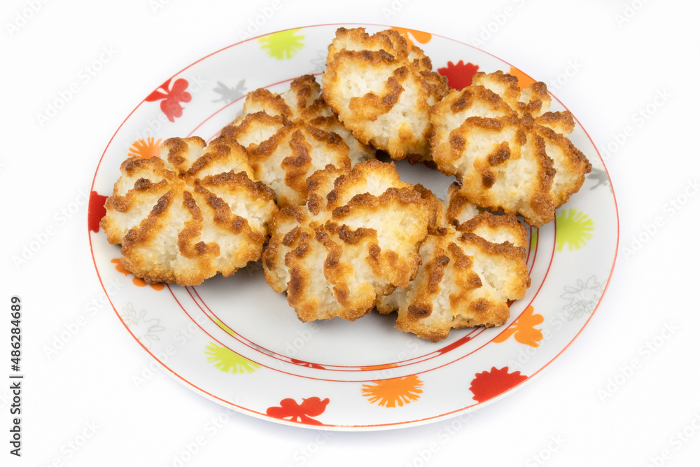 homemade coconut cookies in a plate on a background homemade coconut cookies in a plate on a background
