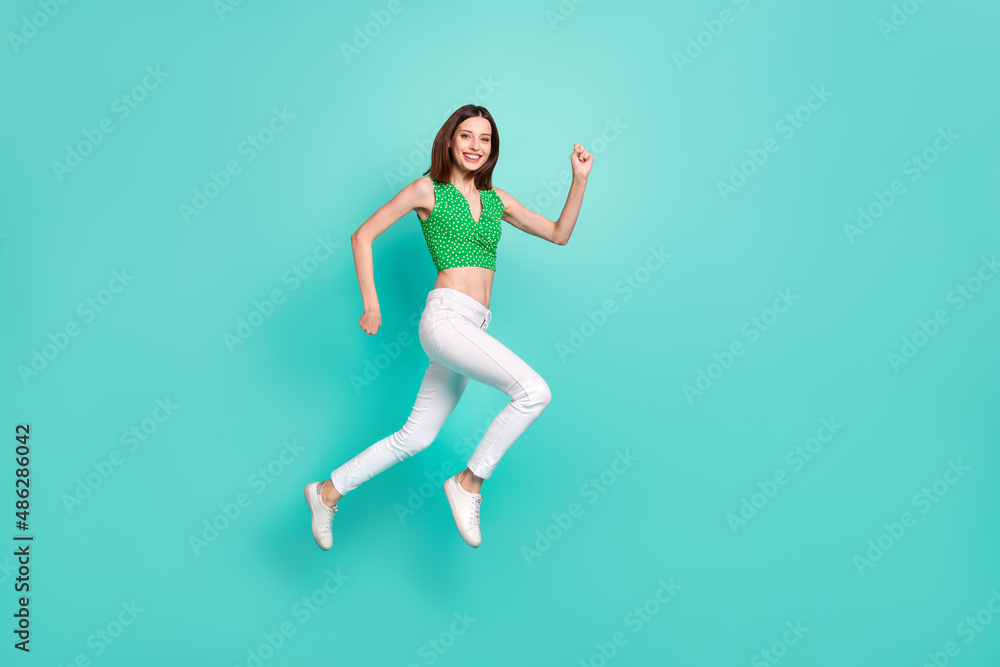 Full body profile side photo of young girl run jump up active rush isolated over turquoise color background