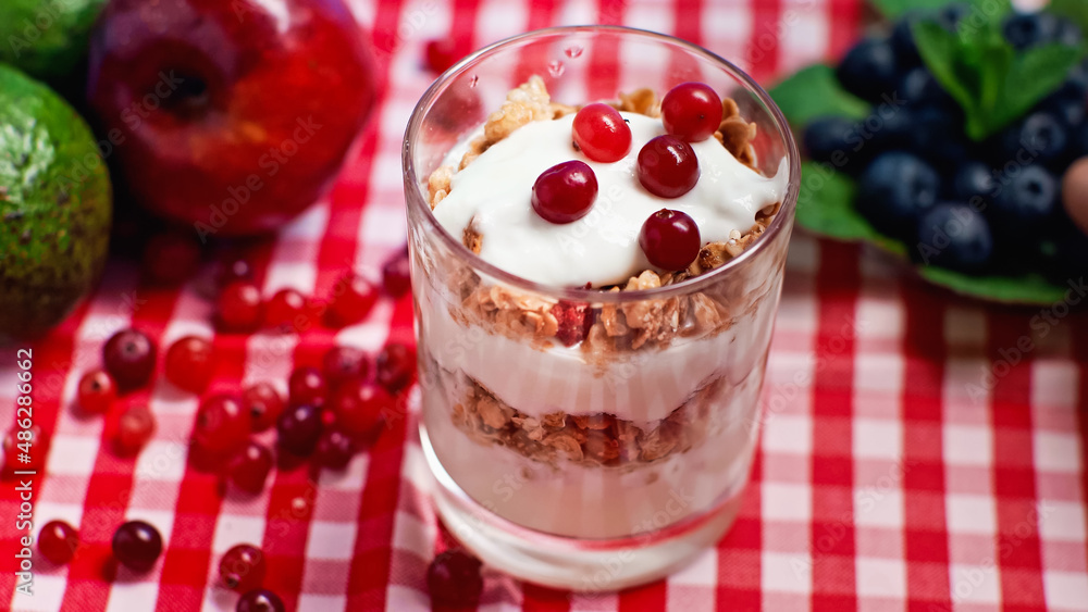 cranberries on top of fresh yogurt with granola cranberries on top of fresh yogurt with granola