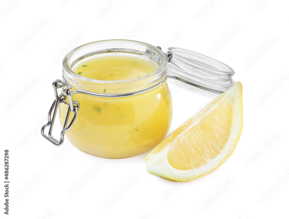 Jar with lemon sauce on white background. Delicious salad dressing Jar with lemon sauce on white background. Delicious salad dressing