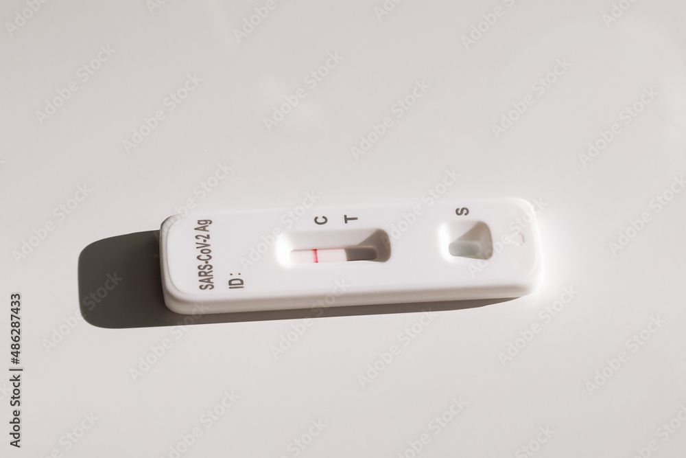 tablet and covid and disease test kit on a white background tablet and covid and disease test kit on a white background